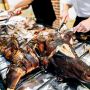 caterers serving a hog roast