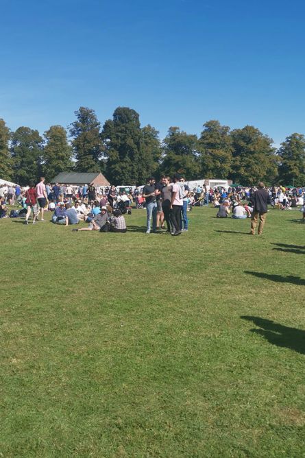 people on a village green at a beer festival