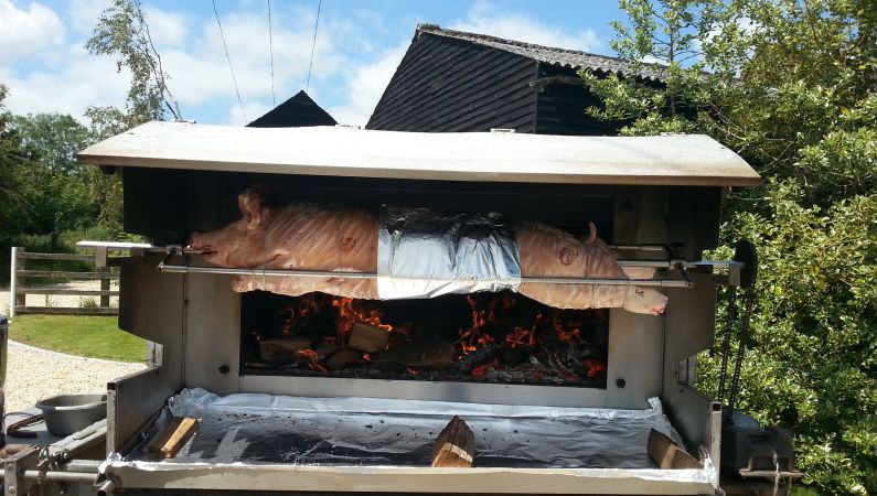Whole pig on a spit fire